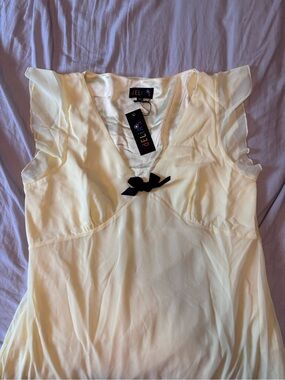 dELiA*s Cream Sleeveless V-Neck Camisole with Black Bow
